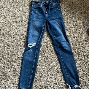 American Eagle button fly skinny jeans.